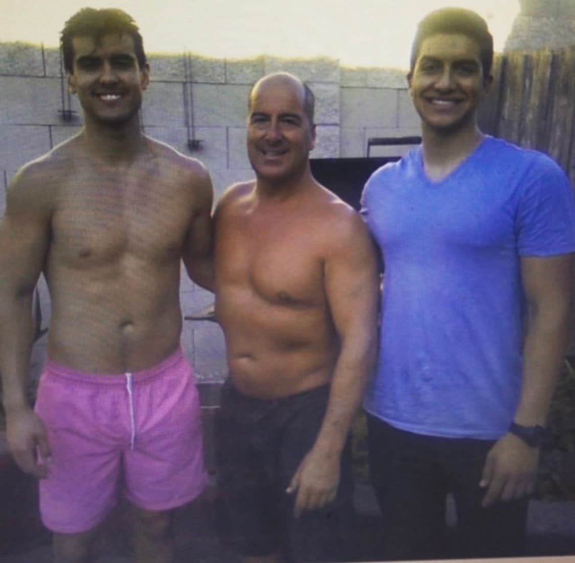 Ty standing with two of his people